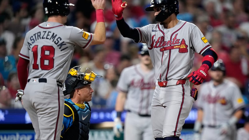 Atlanta Braves' Mauricio Dubón, right, and Mike Yastrzemski celebrate after Dubón's two-run...